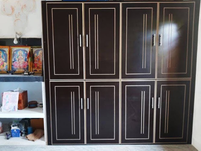 Contemporary black geometric wardrobe with closed decorative grooved panel doors