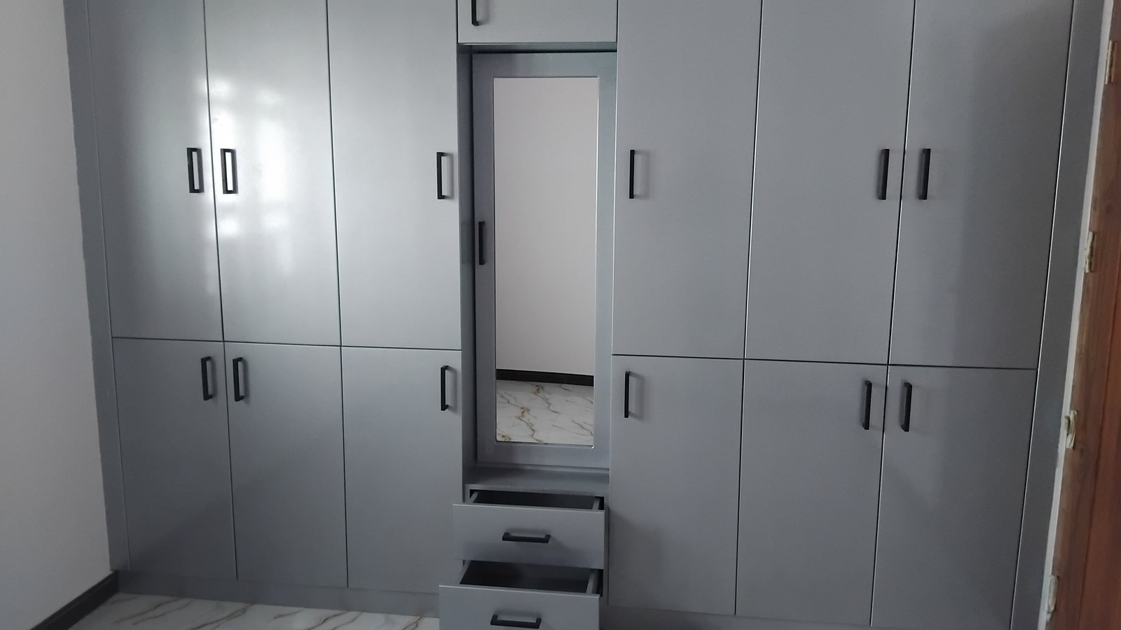 Custom fitted timber bedroom wardrobe and storage cabinetry