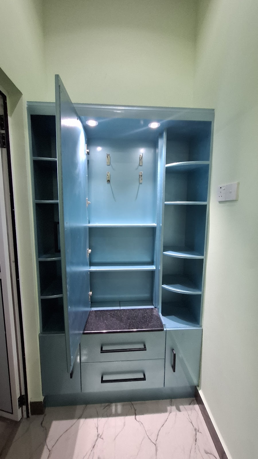 Open view of the dressing unit shelves, mirror, and drawer storage