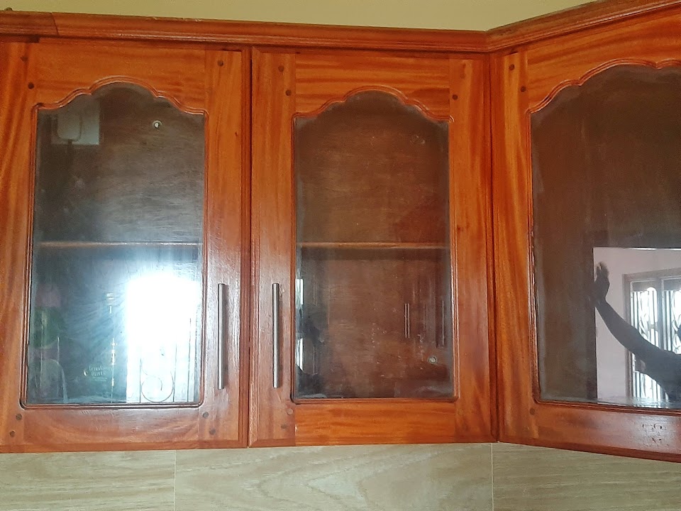 Close-up of corner glazed wall cupboards