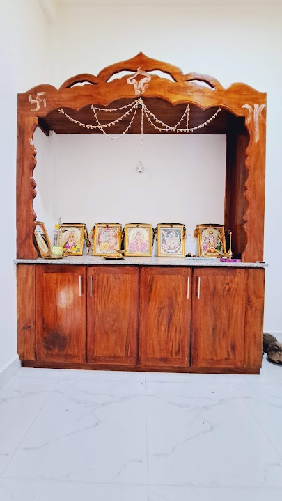 Full front elevation of handcrafted timber pooja prayer shrine cabinet with ornate crest and granite counter