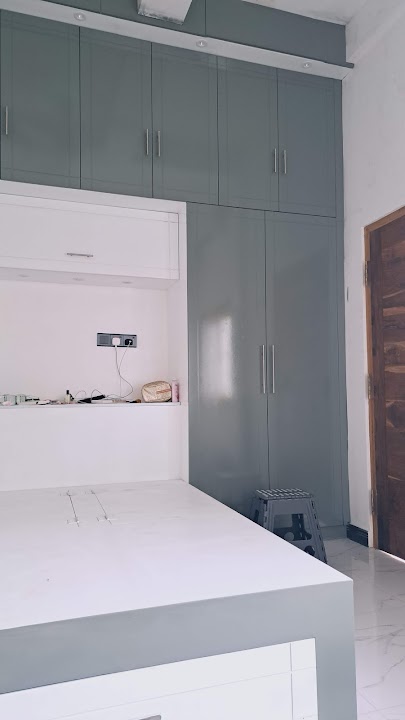 Full height wardrobe wing showing ceiling soffit spotlighting integration
