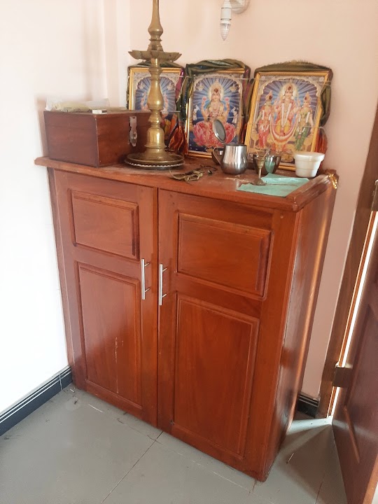 Two-door polished timber prayer shrine cabinet with raised panel doors