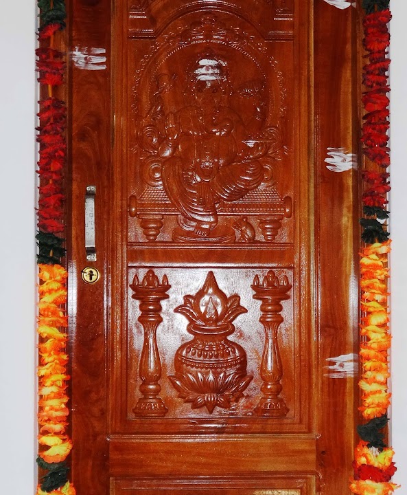 Installed doorway view showing full entrance frame with floral garland