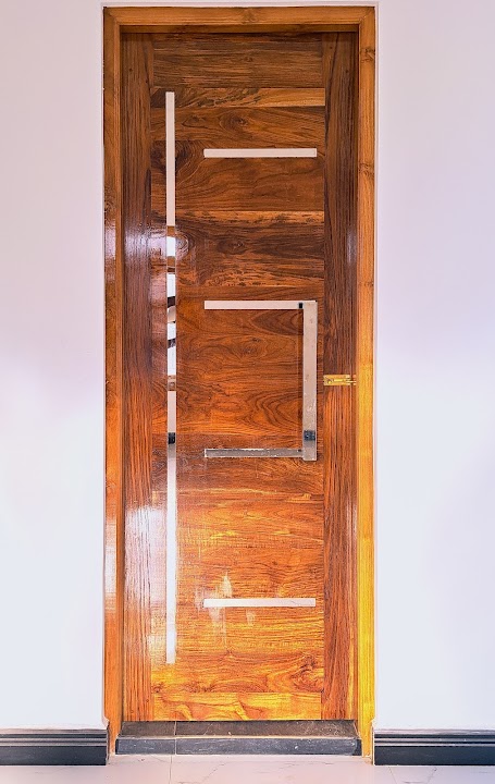 Contemporary timber entrance door with horizontal inlays and modern brushed metal pull handle