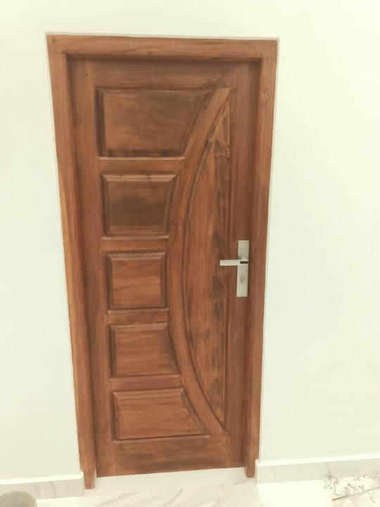 Angled view showing door leaf and timber architrave