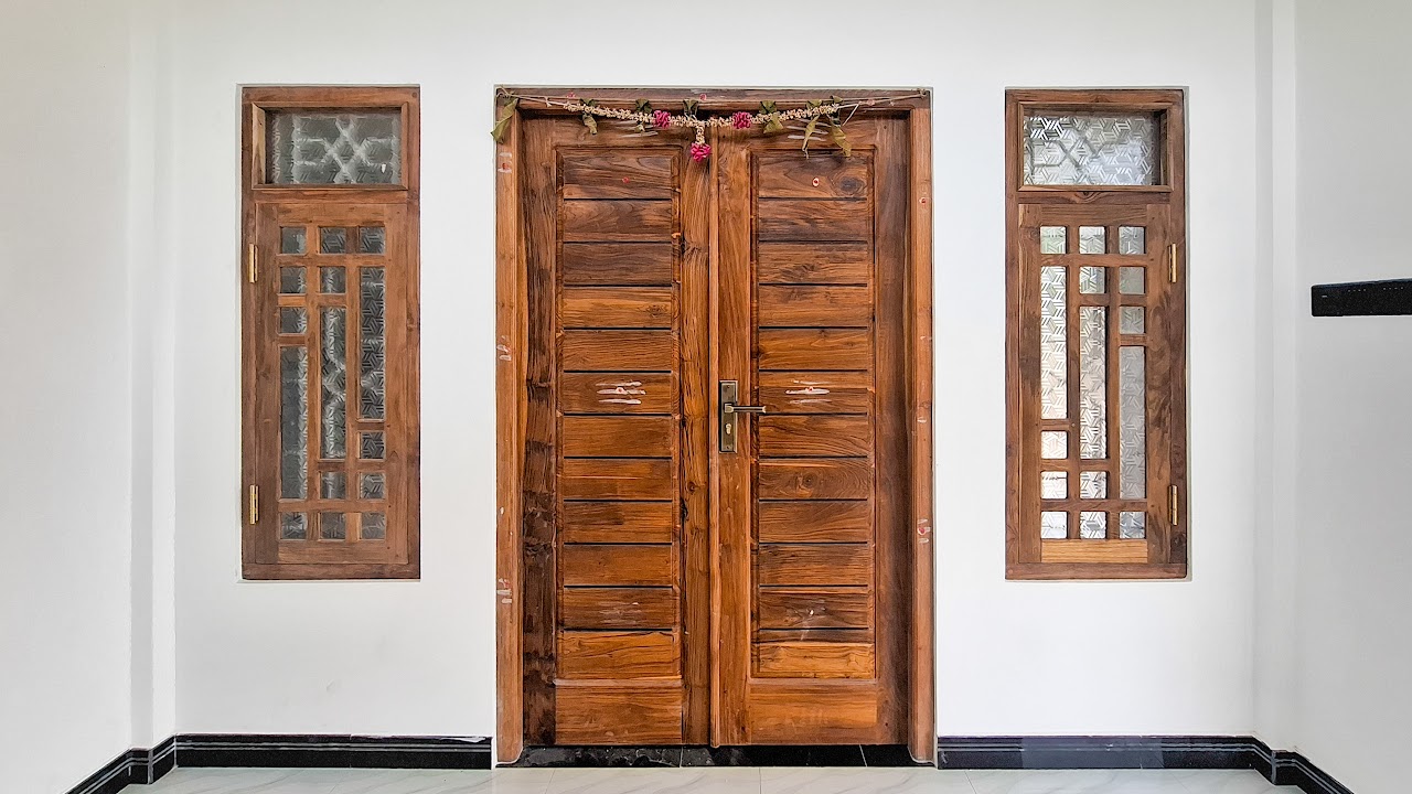 Wide elevation view showing door flanked by two matching lattice windows
