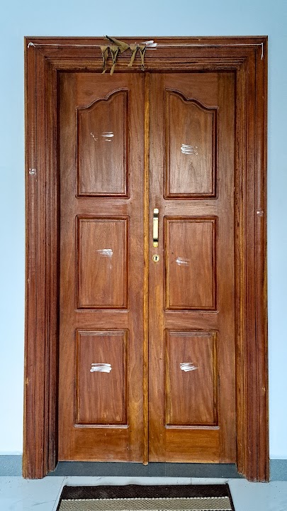 Full front elevation of traditional 6-panel double entrance door with arched upper panels