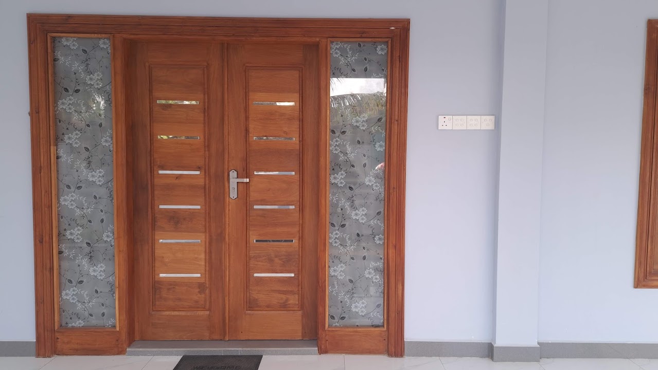 Medium elevation view showing timber door framing and frosted glass