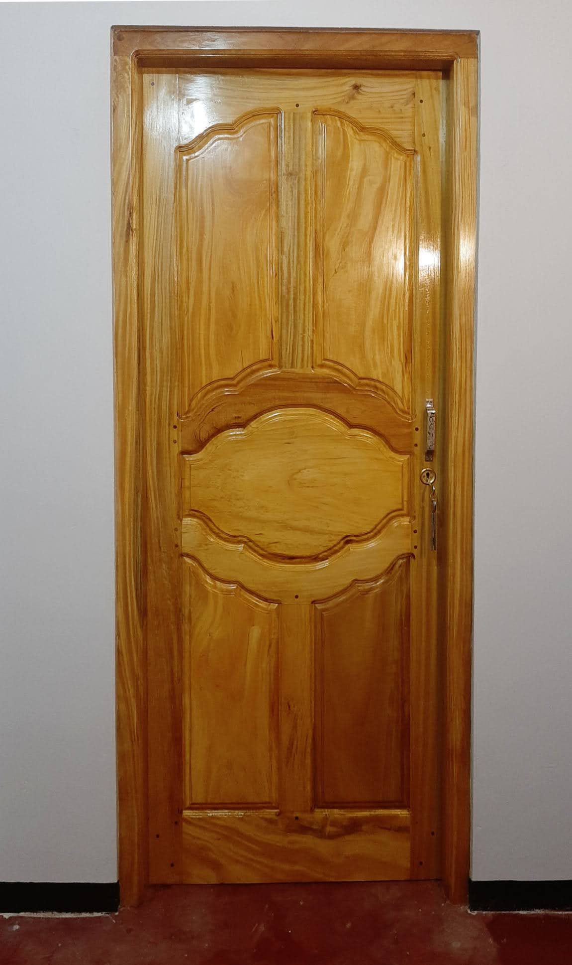 Detail view of door finish and precision hardware fitting