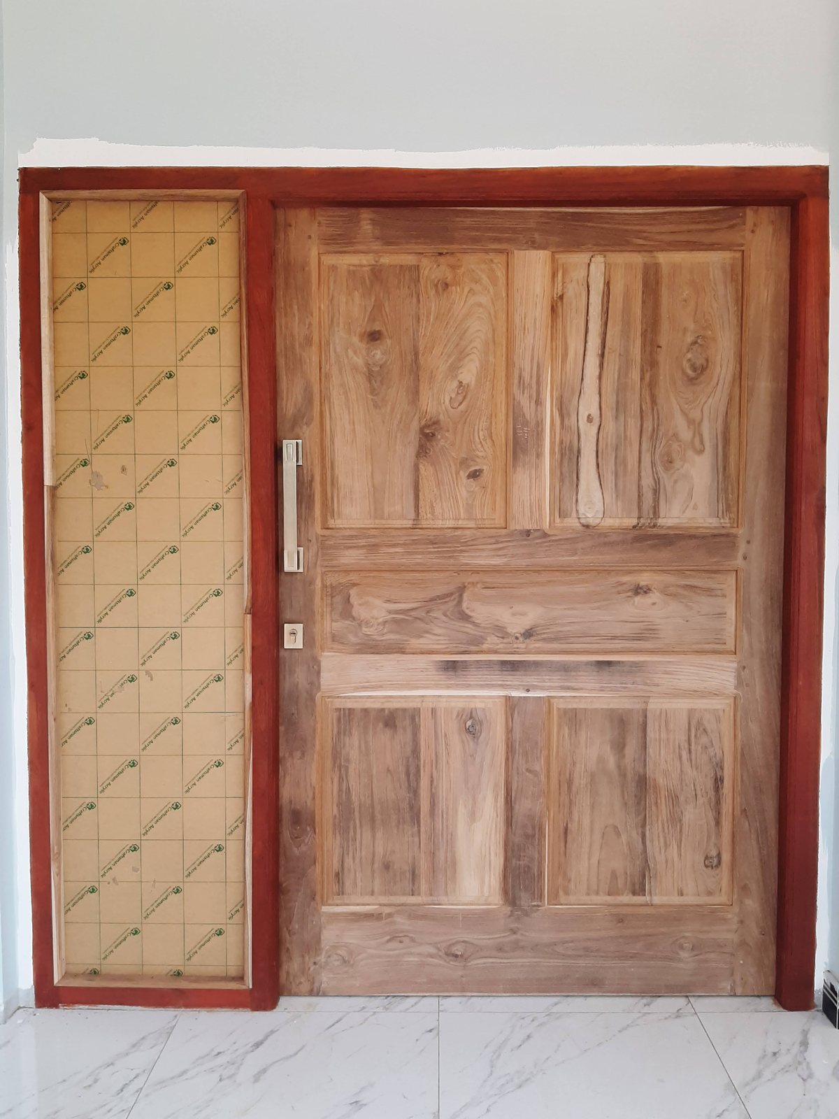 Hand-carved double entrance door front elevation