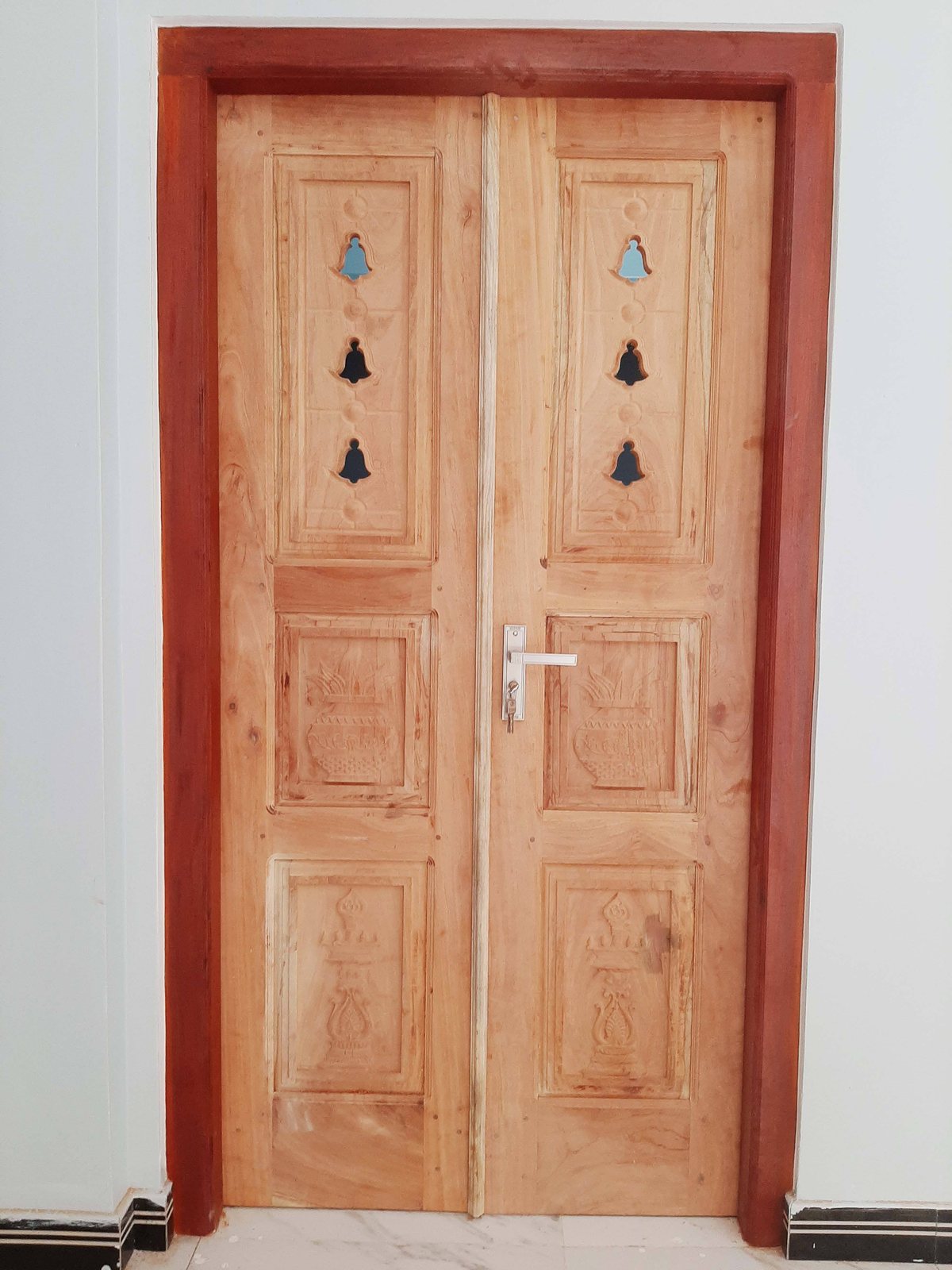 Detail of carved ornamental panel and timber finish