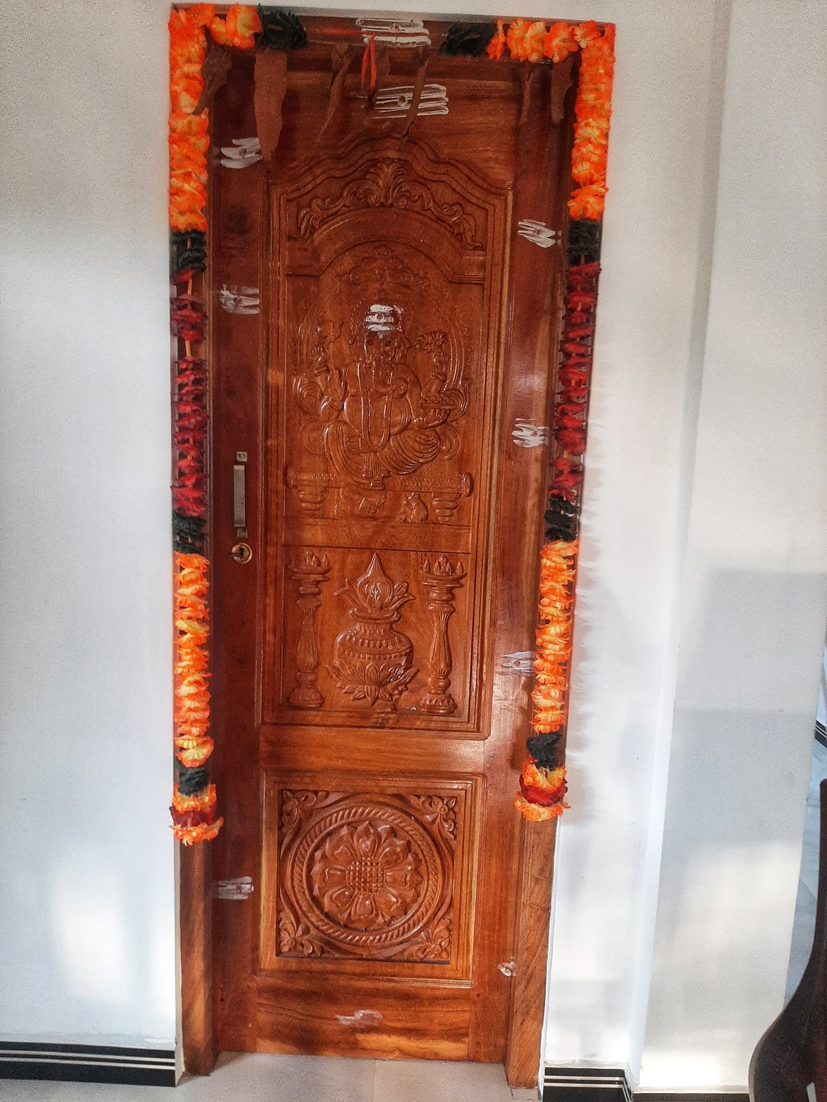 Hand-Carved Floral Motif Timber Door - Solid timber door relief-carved with delicate floral scrollwork and lotus flower motifs.