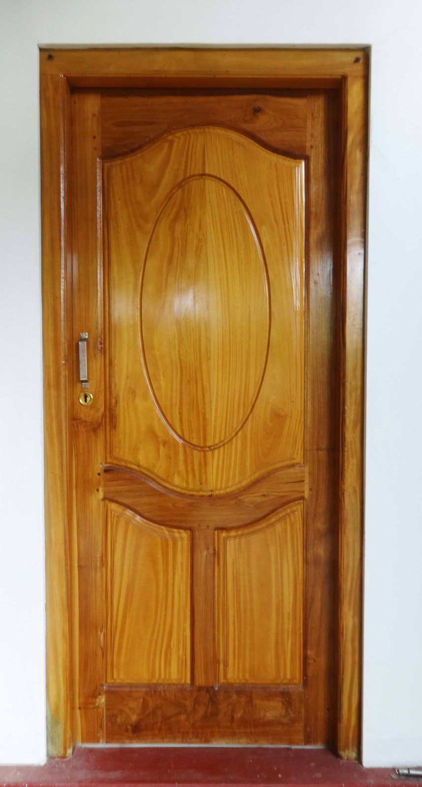 Traditional timber entrance door with deep floral relief carvings