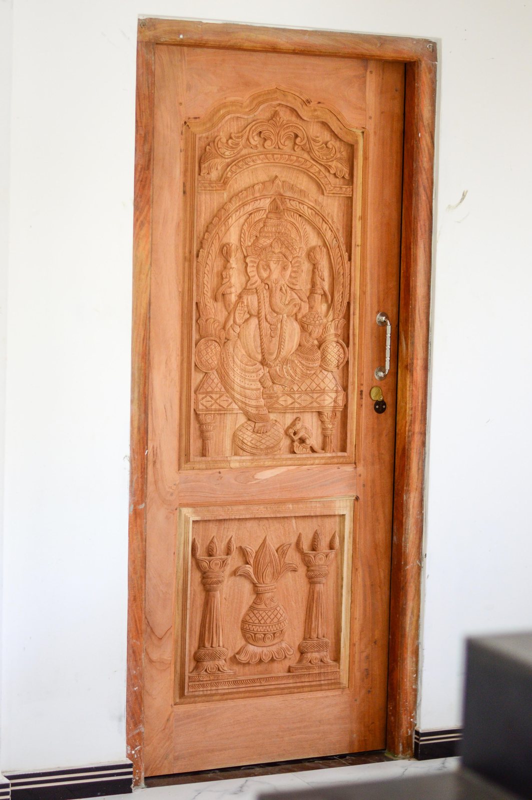 Double entrance door pair showing frame surround and arch detail