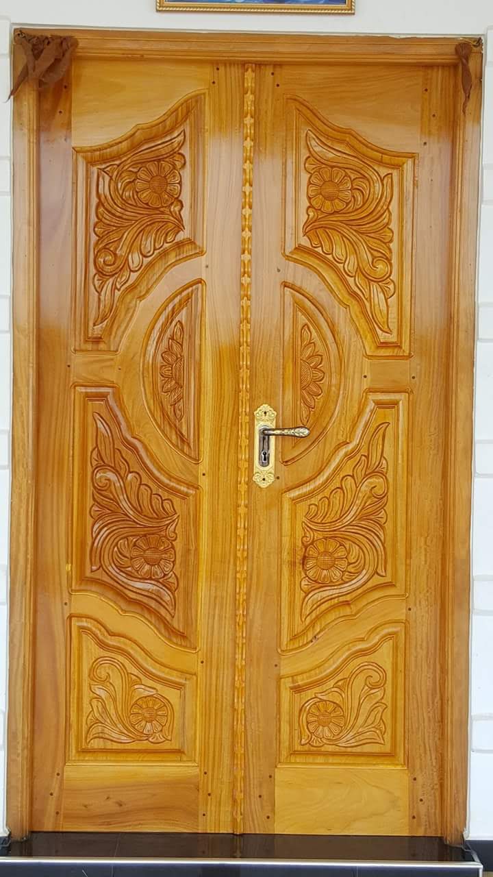 Mandap Style Carved Timber Door - Sacred and ceremonial entrance door with carved arch mandap framing and auspicious symbols.