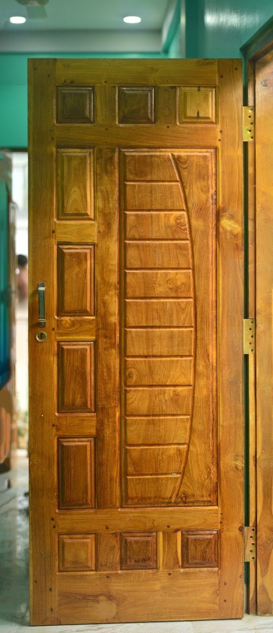 Sculpted Hardwood Double Entry - Handcrafted double entry doors with symmetrical sculpted panels and natural timber luster.