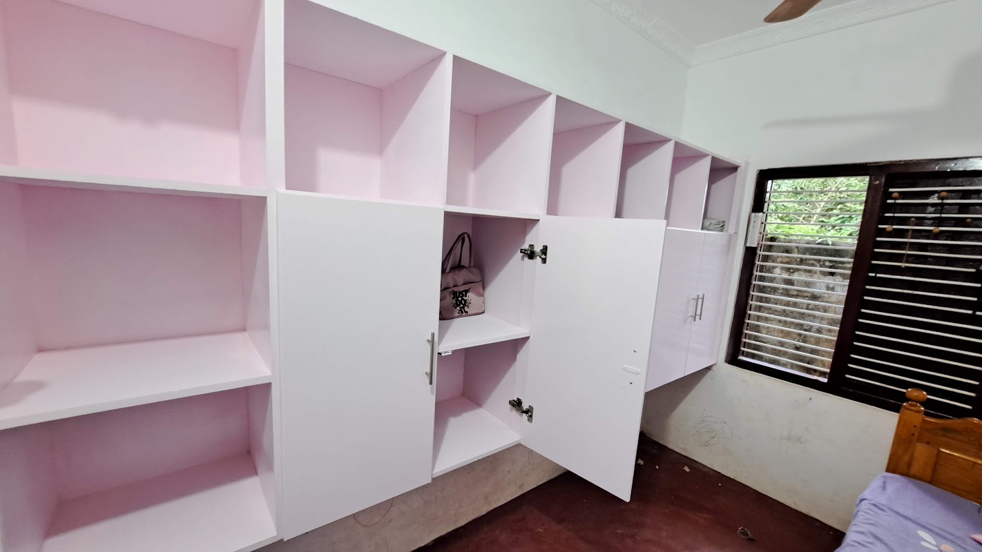 Wall-mounted modular timber cubby shelving unit for living room or bedroom display