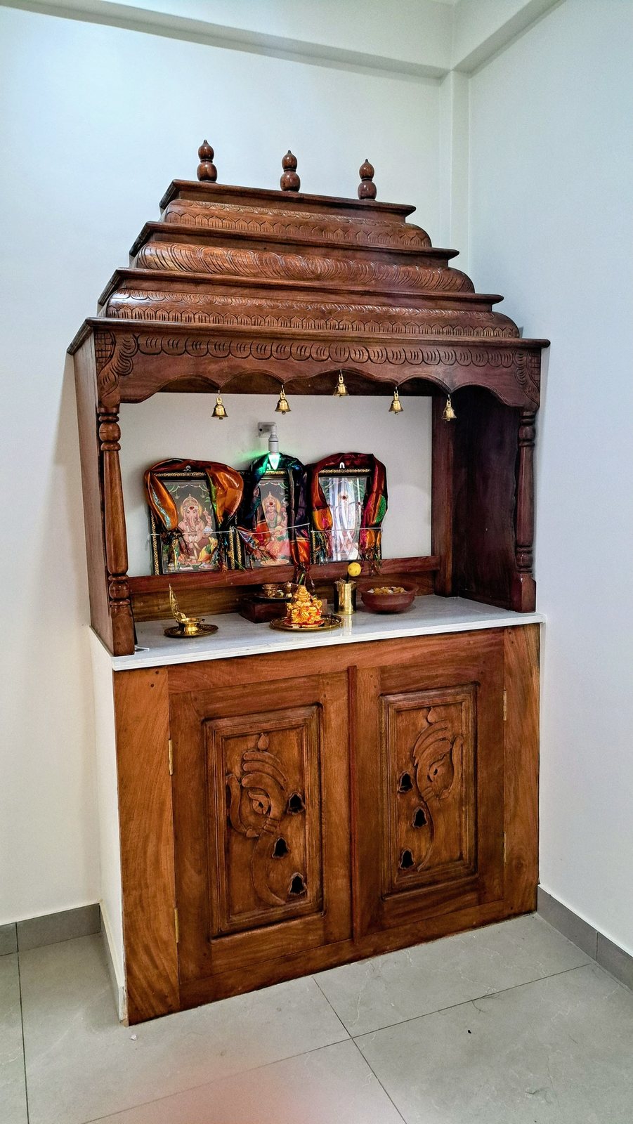Carved solid timber home pooja shrine mandir with traditional crest and storage drawers