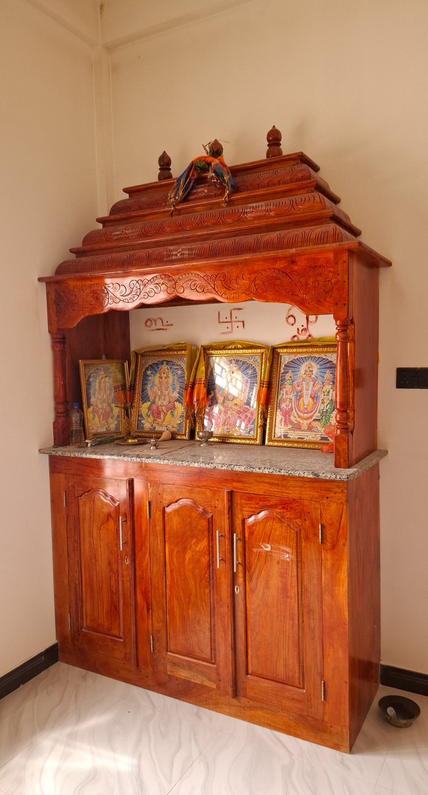 Ornate carved timber prayer cabinet unit with traditional detailing
