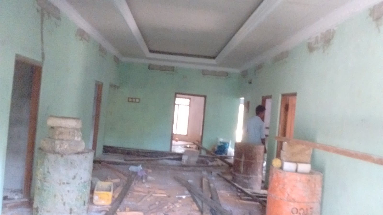 Steel grid framework installed across concrete ceiling
