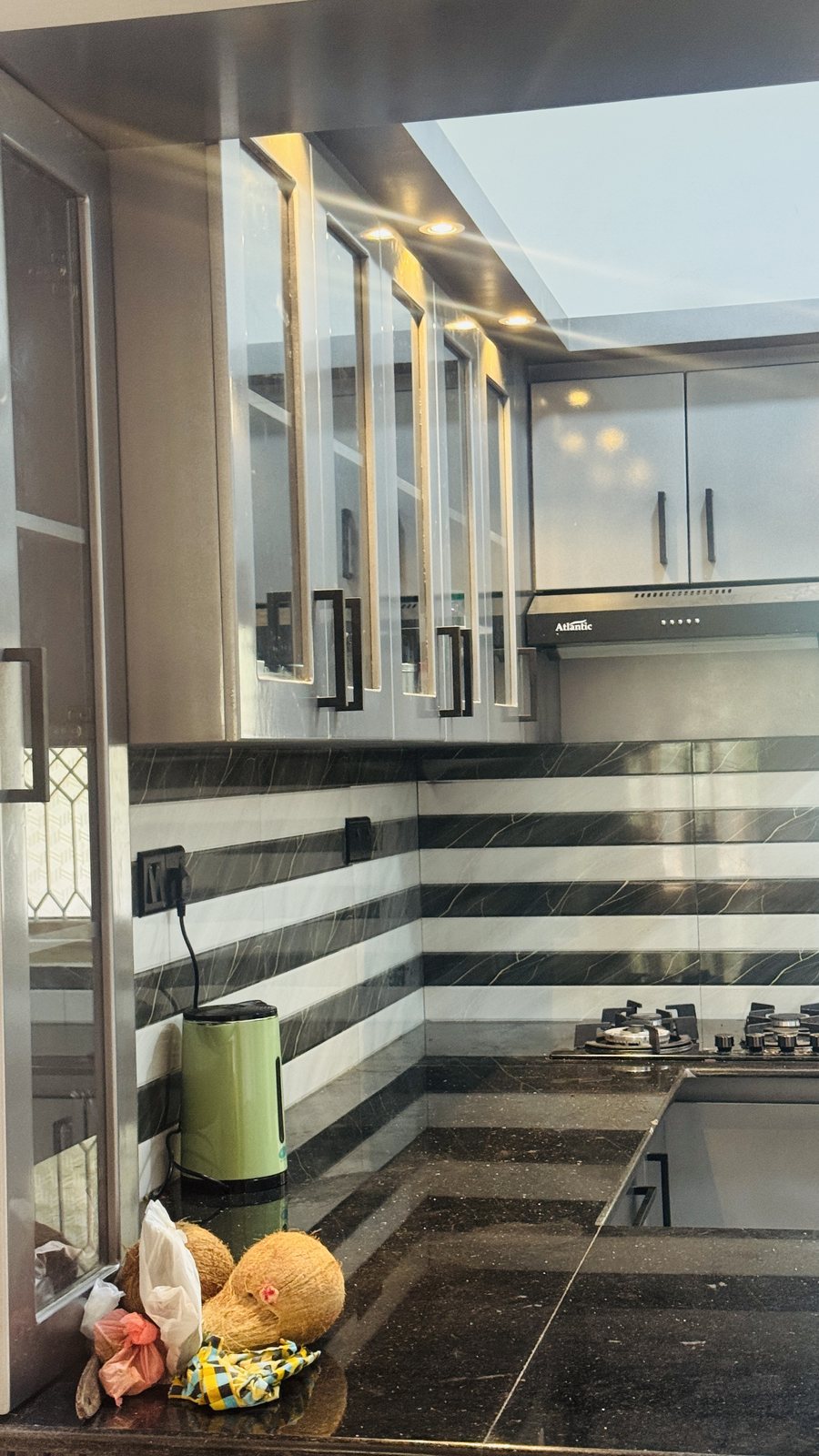 Angled perspective of kitchen cupboards and countertop layout