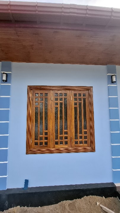 Front wall elevation showing window framed between veranda pillars