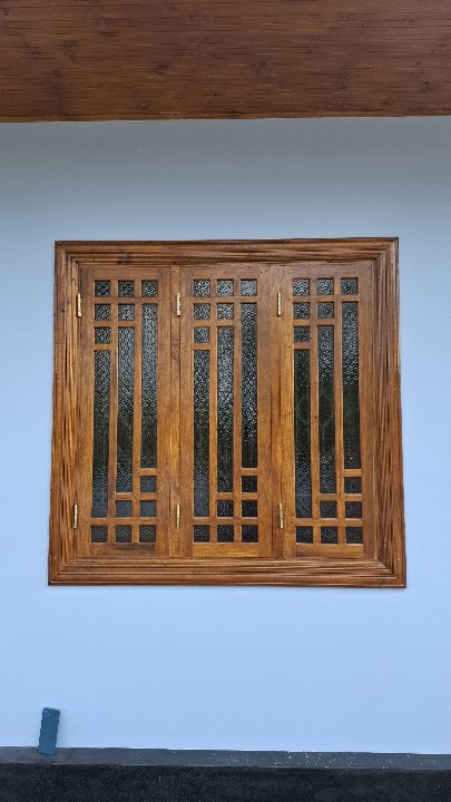 Full front elevation of three-panel timber window with geometric lattice grilles and textured glass