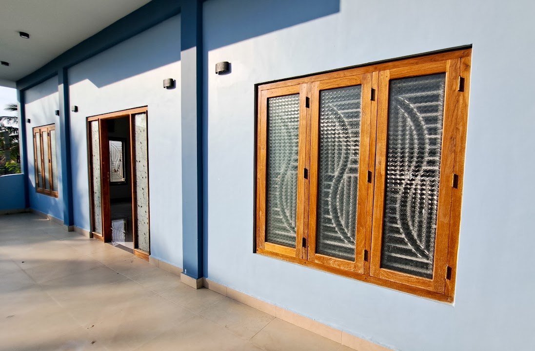 Wide veranda perspective showing windows and porch entrance